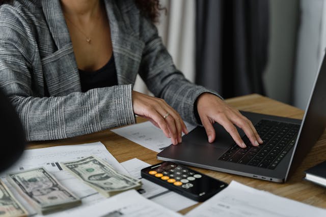 women counting money for cheap hotel booking