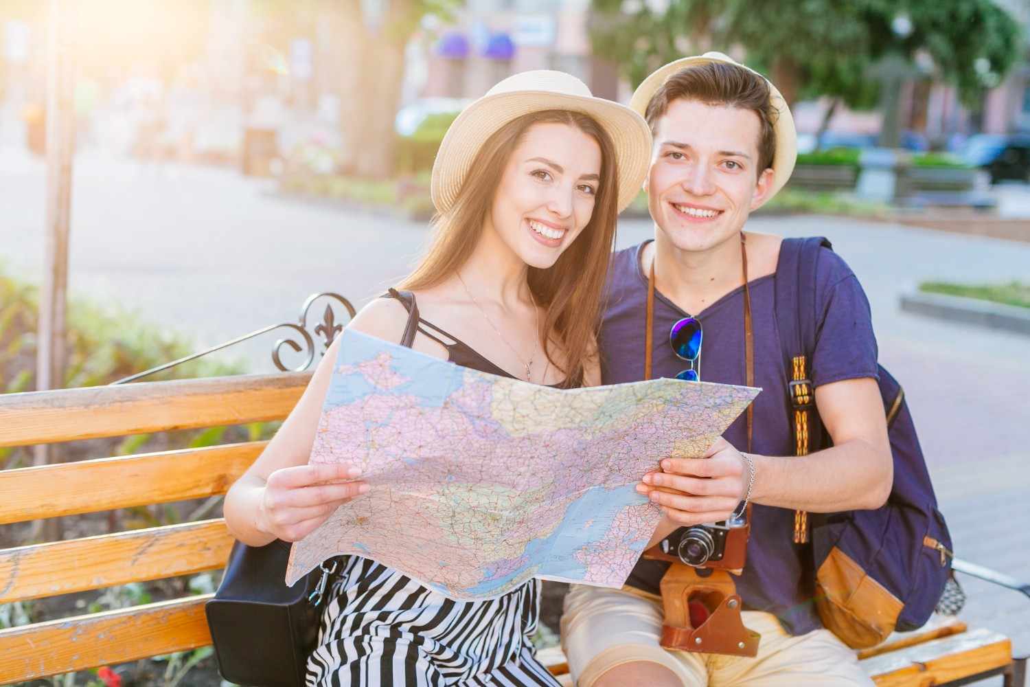 Couple planning their summer journey with a map