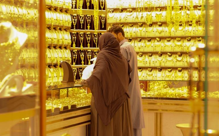 A couple buying gold