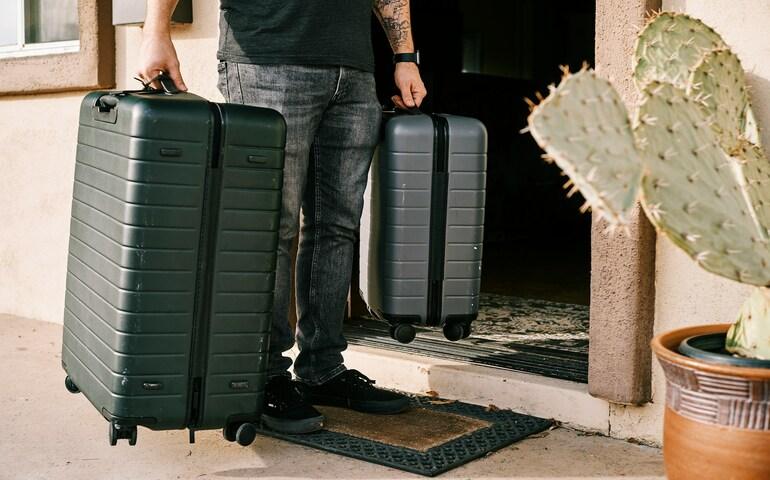 Check-in luggage being carried from home