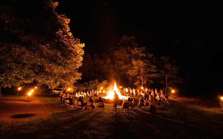 People sitting around bonfire
Image Credit: Jack Cohen/Unsplash