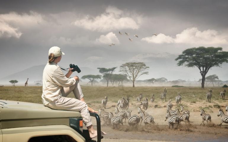 A woman tourist on safari in Kenya