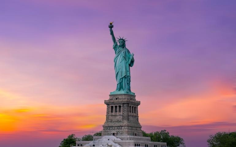 Statue of Liberty at sunset in New York City, USA
