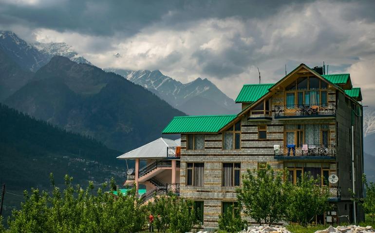 Building Near Mountains at Daytime