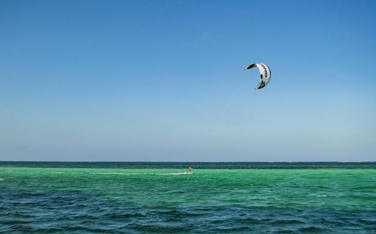 Person on Body of Water Kitesurfing, Diani Beach