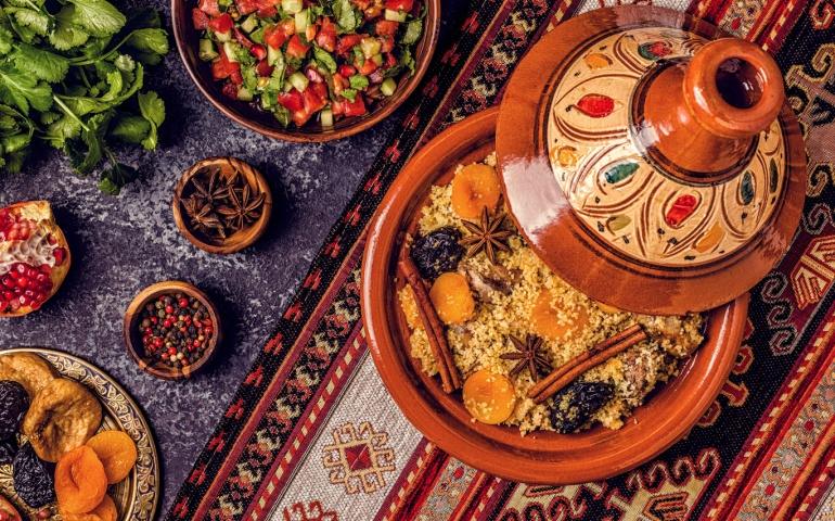 Traditional moroccan tajine of chicken with dried fruits and spices, top view.