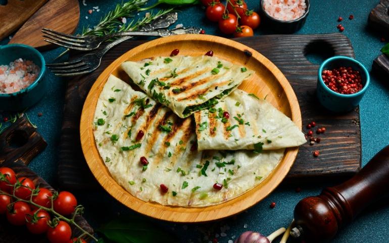 Traditional Azerbaijani cuisine flat bread with herbs and meat.
