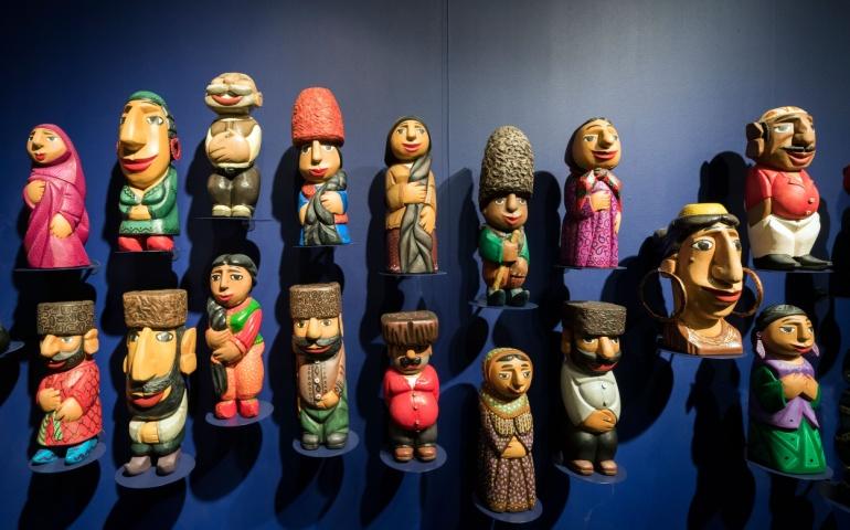 Traditional wooden Azerbaijani dolls on the wall
