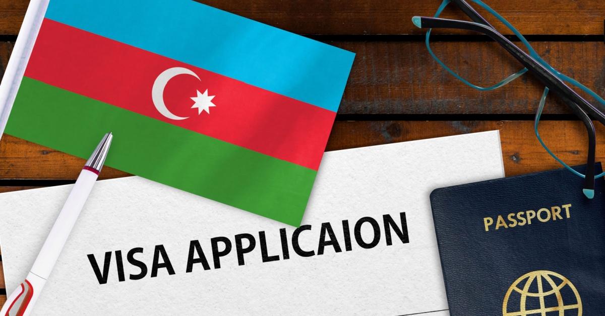 Flag of Azerbaijan , visa application form and passport on table
Image Credit: GagoDesign