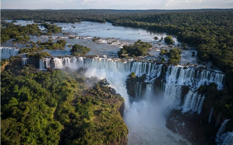Beautiful view to Iguazu Falls waterfalls with green rainforest in the border of Brazil and Argentina
