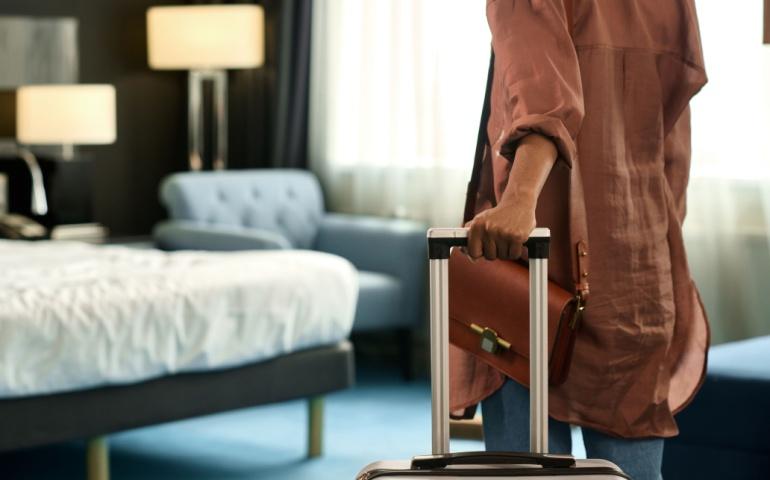 Close Up of Woman Entering Hotel Room