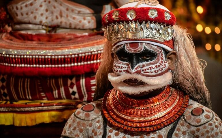 A man dressed up for a Theyyam dance in Kannur