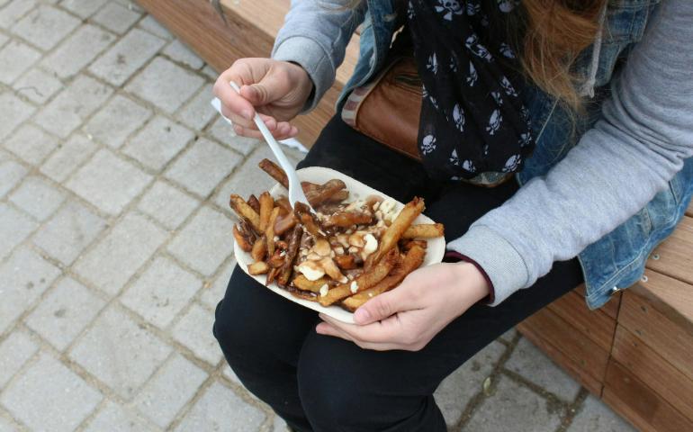 Enjoying Poutine from a Food Truck