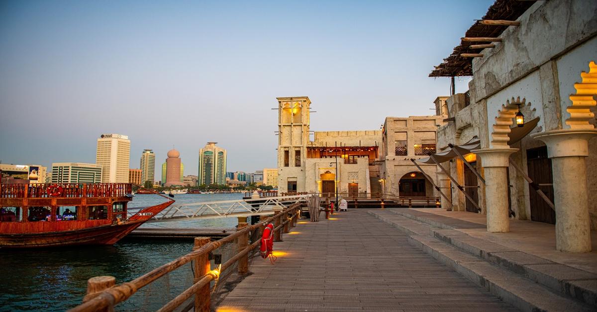 Twilight at Dubai Creek with Traditional Dhow and Al Fahidi Historical Neighbourhood