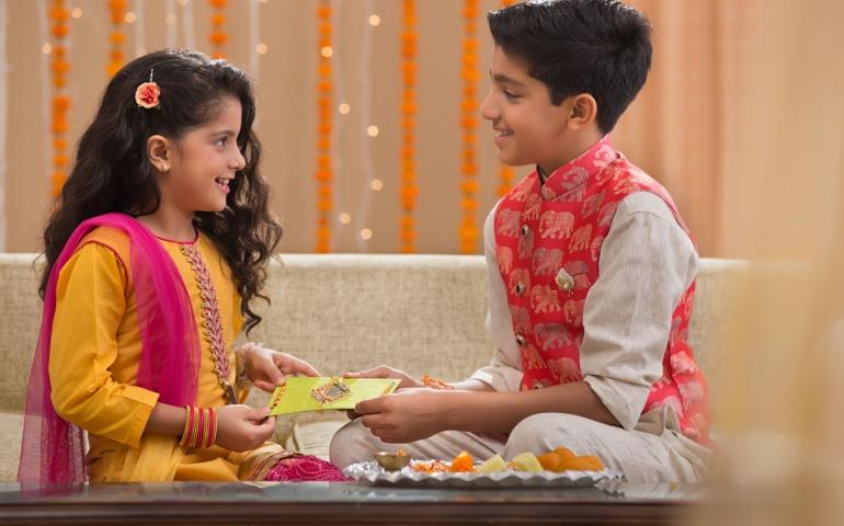 Brother and sister exchange gifts for Bhrati Dwitiya