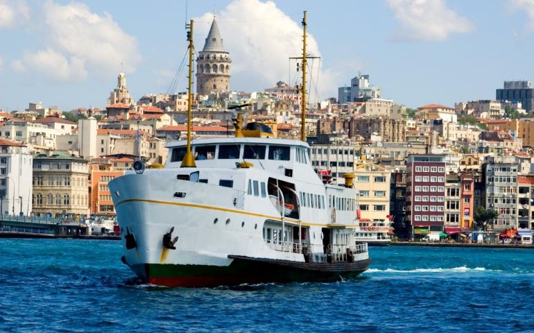 White Ship in the Bosporus with Galata Tower Background