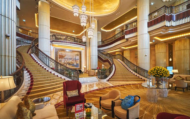 Interior of St. Regis Hotel main lobby with a Titanic staircase