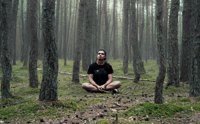 Meditating in the forest
