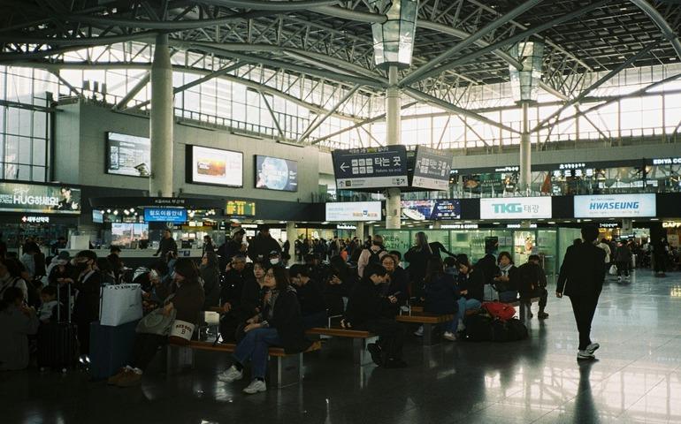People Waiting at Airport Terminal in Korea