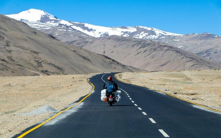 A man rides a motorbike on the Leh Manali Highway