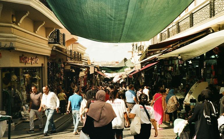 People Walking alongside the Shops in Turkey Market
