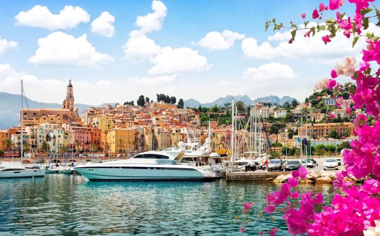 A superyacht at Menton old town harbor, French Riviera