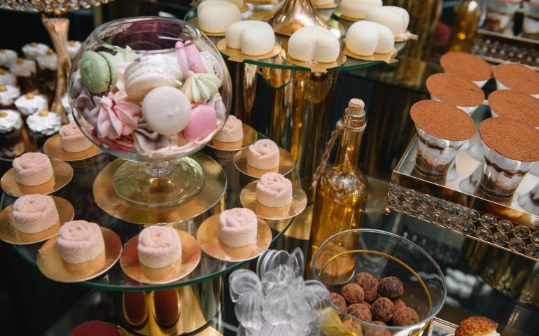 Colourful macarons and desserts for sale at a patisserie in Paris, France