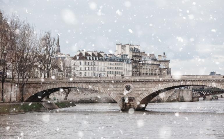 The Seine River in Paris on a snowy winter day