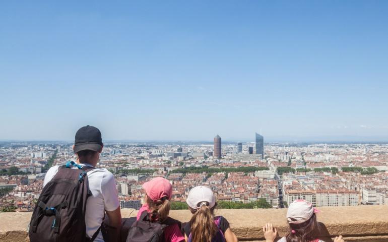 A family enjoying panoramic views of the Lyon skyline