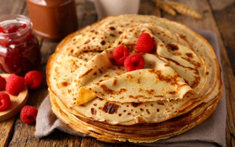 Stack of crepes with raspberry and chocolate
