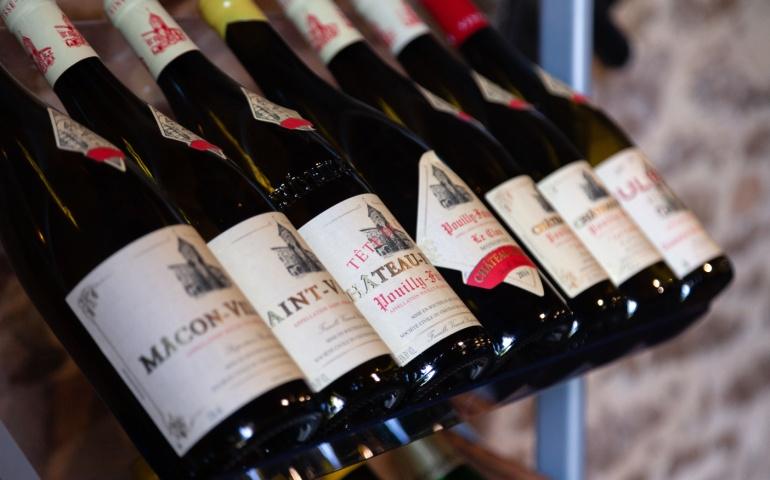 Wine bottles with delicious luxury wine on shelf, Lyon