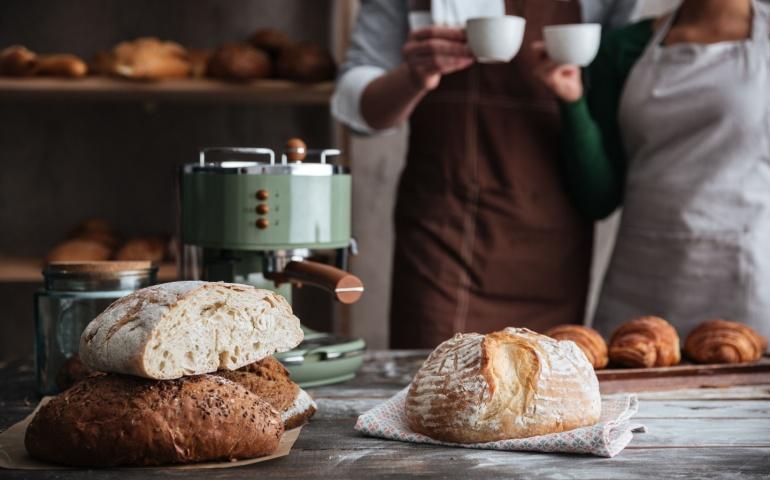 A couple enjoying a croissant baking class together in Paris