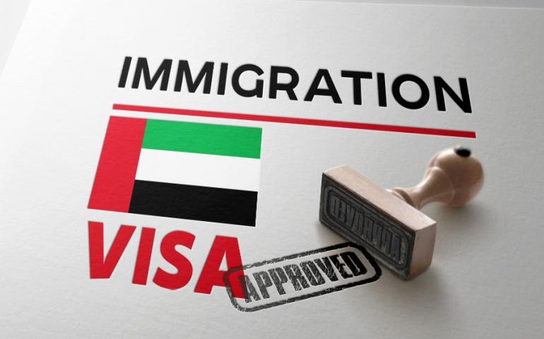 United Arab Emirates Visa Approved with Rubber Stamp and national flag