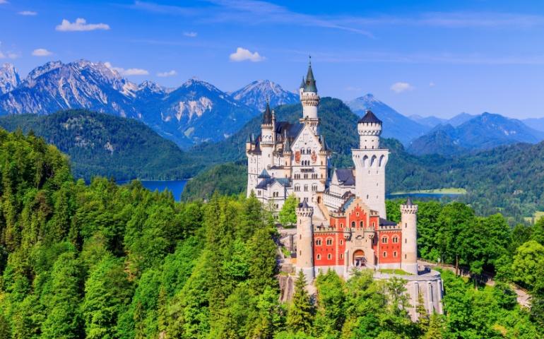 Neuschwanstein Castle with the Bavarian Alps in the background
