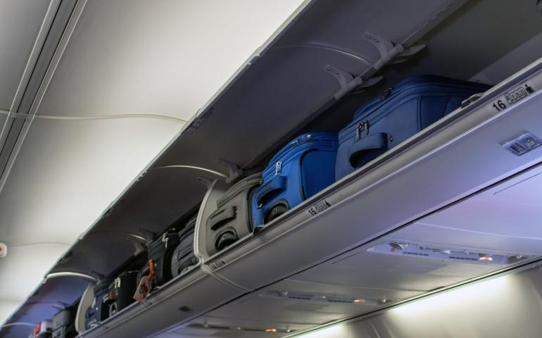 Carry on luggage in the overhead cabin