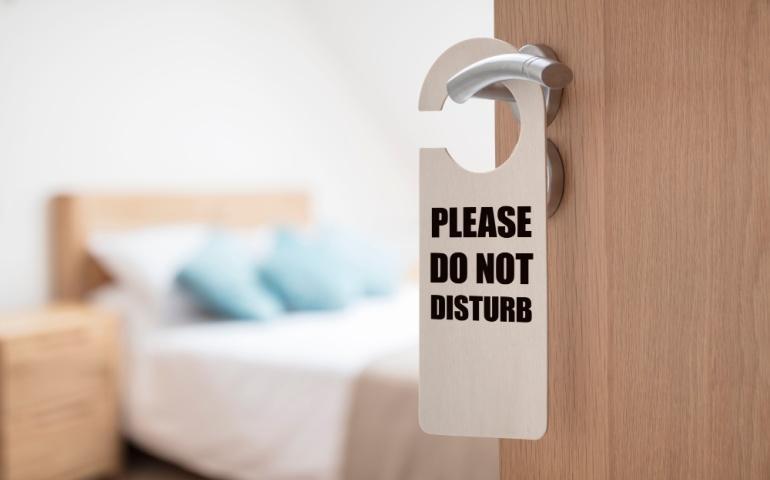 DND sign on the hotel room door