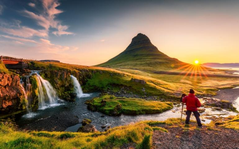 Sunrise over Kirkjufell mountain with Kirkjufellsfoss waterfall
