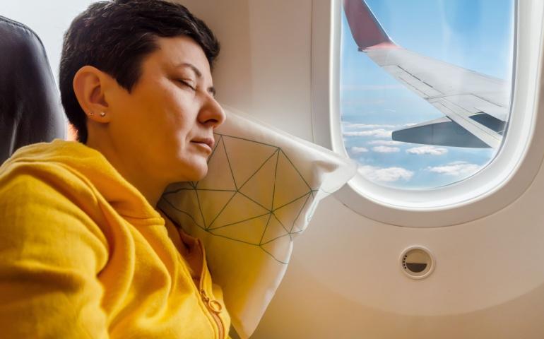 A person sleeping in the aircraft