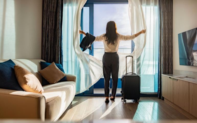 Solo female traveler checking into hotel