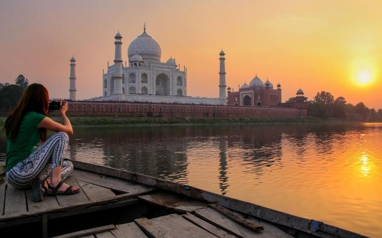 Women taking photo of the Taj Mahal