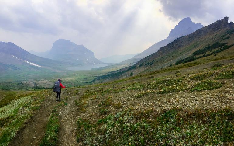 Hiker Standing in the Foggy Mountain Range in Banff

