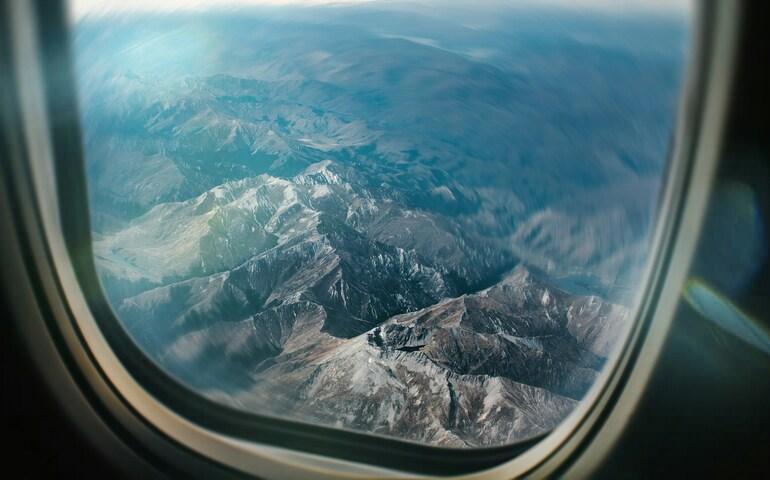 View from airplane window in front of the wing