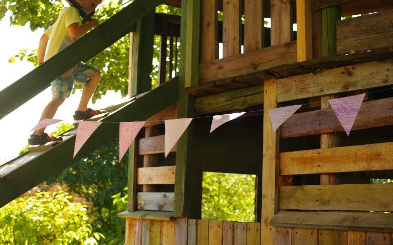 Kids playing in a treehouse
