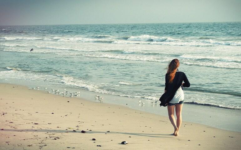 Woman walking on a beach