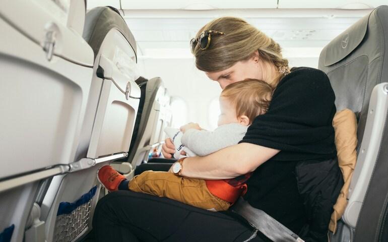 
Baby in an Aircraft with mom