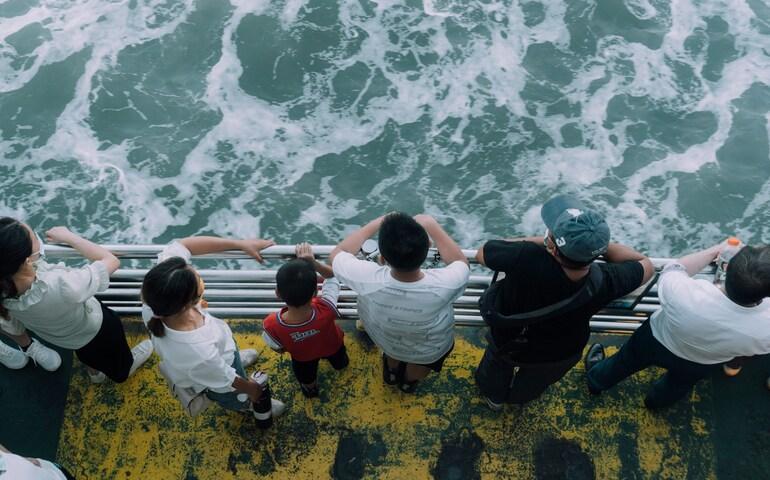 People looking down from the ferry