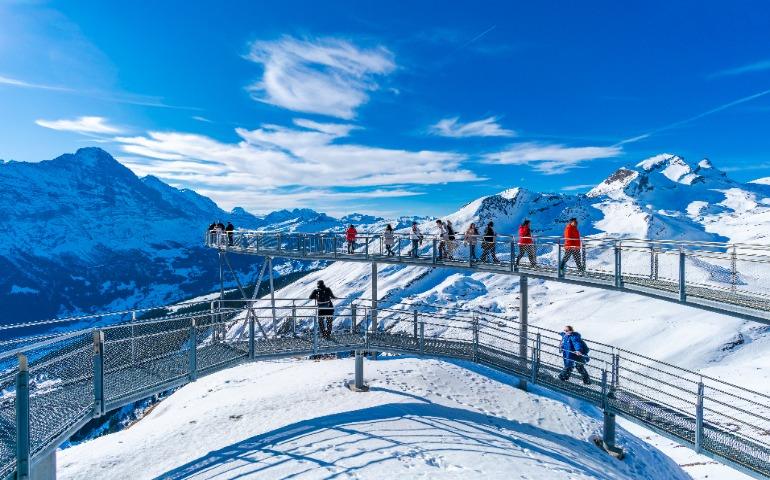 Tourists take photos on the Cliff Walk, a popular viewing platform on the First Mountain in Grindelwald
Image Credit: BBA Photography/Shutterstock