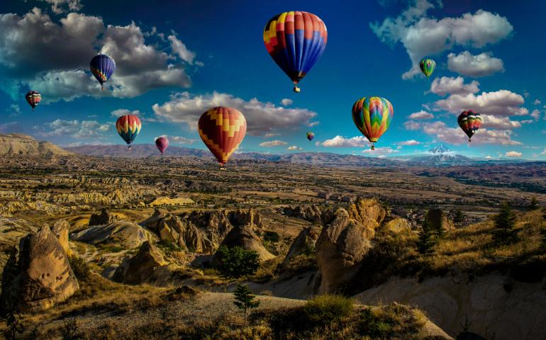 Hot Air Balloons over Mountain Range