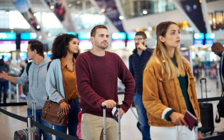 Passengers queuing up at the airport
