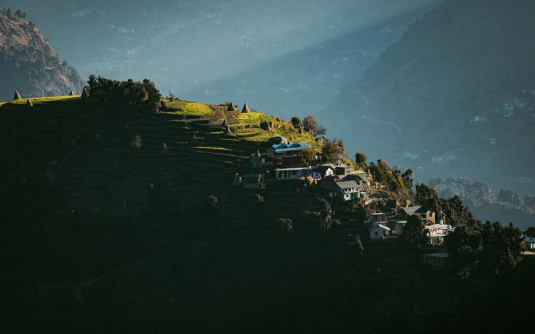 a town on a hill by the water
